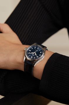 A refined take on one of the brand's signature styles, this 36mm 'Pilot's' timepiece is perfect for watch lovers with a slightly slimmer wrist - it's the smallest in IWC SCHAFFHAUSEN's portfolio. This elegant design has an uncluttered blue dial and a partially polished stainless steel case with a recessed inner-circle - we love how this detail creates a more structured, three-dimensional appearance. The alligator strap is made by Italian leather specialists, Santoni.  All IWC SCHAFFHAUSEN watch… Iwc Schaffhausen, Iwc Pilot, Signature Styles, Watch Lover, Inner Circle, Breitling Watch, Signature Style, Silver Watch, Net A Porter