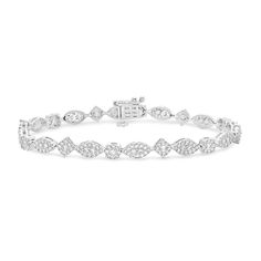 Exude an elegant vibe with the vintage-inspired details of this regal marquise-shaped multi-diamond line bracelet. Created in cool 10K white gold Marquise-shaped composites of round diamonds shimmer in rope-textured frames. Captivating with 3 cts. t.w. of diamonds This 7.0-inch bracelet secures with a box clasp. Formal Marquise Diamond Bracelet With Diamond Accents, Formal Marquise Diamond Bracelet With Accents, White Marquise Diamond Bracelet For Formal Occasions, Classic Marquise Diamond Bracelet In White Gold, Classic Marquise White Gold Diamond Bracelet, Elegant Marquise Cut Bracelets For Formal Occasions, Elegant Marquise Cut Formal Bracelets, Elegant Formal Bracelets With Marquise Cut, Marquise Diamond Accents Tennis Bracelet For Wedding