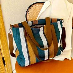 Brand New Never Used Teal, Gold And White. Colorful Striped Summer Cross Body/ Shoulder Bag Attractive, Lightweight Weave Design Third Picture From The Top Is For Size Reference Only And It's Not The Color Of The Bag. Versatile Summer And Shopper Bag Size: 11" X 14" X 4" Approximately All Offers Are Welcome And Thank You For Stopping By My Closet! If You Have Any Questions Please Leave Them In The Comment Field. Thanks Multicolor Shoulder Bag With Adjustable Handle For On-the-go, Blue Hobo Tote Bag With Top Carry Handle, Blue Hobo Bag With Top Carry Handle, Blue Satchel Shoulder Bag With Large Capacity, Blue Bucket Bag With Top Carry Handle For Travel, Blue Bags With Top Carry Handle For Daily Use, Blue Satchel With Large Capacity As Shoulder Bag, Blue Shoulder Satchel With Large Capacity, Blue Large Capacity Satchel Bag