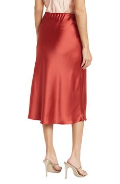 Elevate your wardrobe with this pull-on bias satin midi skirt for elegant, feminine style. 31" length (size S) Elasticized waist Pull-on style Satin construction 97% polyester, 3% spandex Machine wash cold, line dry Made in USA Model’s stats for sizing: 5’10” height, 34” bust, 27” waist, 35” hips. Model is wearing size S. Relaxed Fit Satin Midi Pencil Skirt, Relaxed Satin Pencil Midi Skirt, Silk Bias Cut Midi Skirt, Satin Midi Bottoms For Evening, Evening Satin Midi Bottoms, Silk Midi Skirt With Bias Cut, Relaxed Midi Skirt With Bias Cut, Formal Satin Midi Skirt, Sleek Satin Bottoms Midi Length