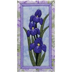 a painting of purple flowers in a frame