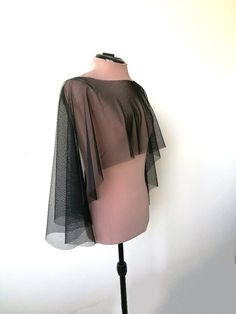 "Halloween cape, Black tulle  capelet, , Witch cover up This is simply  tulle cape, will be perfect compliment for your Halloween dress, Gothic or Vampire look.  Also It has a romantic yet minimalist feel, and would match many gown styles. DETAILS COLOR   - Black  LENGTH  front side- 30 cm (11,8'') back side 50 cm (20 \") SIZE  One size **IMPORTANT** * CUSTOMER WILL PAY FOR SHIPPING IN CASE OF RETURN *colours may vary from originals depending on computer monitor or smartphone settings. The produ Chic Stretch Shrug For Party, Elegant Fall Cape For Party, Elegant Cape For Fall Party, Elegant Fall Party Cape, Stretch Shrug For Party In Fall, Black Capelet For Costume, Chic Capelet For Party, Sheer Black Tulle Fabric For Party, Black Shrug For Fall Party