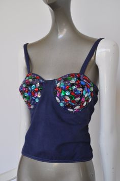 Great cotton bustier from the 80s. This comes from europe. The fabric is cotton, the beads are all present multicolor plastic beads (none missing). There is no maker or sz label, I believe its a sz m. Please see measures. The beaded cups are lined in fiber.The back is netted. The material has some stretch to it. Very good pre-owned condition, no odors or stains. Free domestic shipping get 15% discount w code crazyfashion Measures, Length 10 inch, Bust 30 inch total, cup size 5x5 inch, I believe Retro Cotton Party Tops, Fitted Cotton Tops For Evening, Fitted Cotton Evening Top, Fitted Cotton Top For Evening Wear, Sleeveless Cotton Sequin Top, Fitted Multicolor Beaded Tops, Vintage Beaded Tops For Summer, Beaded Bustier, Ralph Lauren Leather