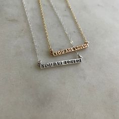 Buy in 14K Gold. You ARE loved, even on the days you think you aren't or couldn't possibly be. It's a truth we believe in. Wear or gift this as a wearable reminder of that truth. Who knows, it might just be the thing a stranger needs to see the day you're wearing it. This dainty bar necklace measures approximately 1-1/4" x 1/8" and is assembled on our Everyday Chain. To create the original version of this intricate piece, we used 3D-printed elements combined with our method of hand-carving wax. Dainty Bar Necklace, Handmade Bar, Heart Shaped Candy, You Are Loved, Birthstone Bracelets, Birthstone Earring, Love Necklace, Birthstone Necklace, Bar Necklace