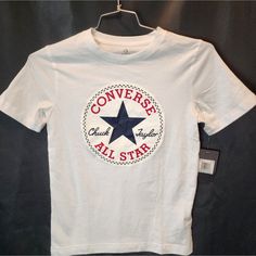 New With Tags. Converse All Star Chuck Taylor White T- Shirt Cotton Tee Boys Age 10- 12. Chest 16 Inches Length 23 Inches. Retail Price $16. Size M Thanks So Much For Shopping! Trusted 5 Star Seller! We Typically Ship Daily!! 100% Authenticity Guaranteed! Meaurements Are Laid Flat, Approx. E-Shopping Nv Converse Graphic Print Short Sleeve T-shirt, Casual Cotton Tops With Star Logo, Cotton T-shirt With Star Patch For Summer, Converse Cotton Graphic Tee, Converse Graphic Tee In Cotton, Converse Graphic Tee Crew Neck Top, Converse Graphic Tee Cotton Top, Casual White T-shirt With Star Patch, Casual White T-shirt With Star Print