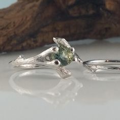 Made-to-Order Custom Twig Bridal Set using a Beautiful Natural Green Montana Sapphire Gemstone Ring. Hand sculpted Twig Bridal Set, hand sculpted, a one-of-a-kind creation. I wanted to create a beautiful yet elegant bridal set using a polished faceted Gemstone using my organic twig design. ● 5.2mm aproximately 1/2 carat round polished faceted natural Montana Sapphire (SHOWN) OPTIONS: So many round 1/2 carat gemstones are available to use in my twig setting. To name a few, Opal, Sapphires, Rubies Nature-inspired Diamond Wedding Jewelry, Nature-inspired Sterling Silver Wedding Rings, Nature-inspired Sterling Silver Wedding Jewelry, Nature-inspired White Gold Jewelry For Formal Occasions, Nature-inspired Sterling Silver Jewelry For Wedding, Nature-inspired Sterling Silver Jewelry For Weddings, Nature-inspired Wedding Jewelry With Prong Setting, Sterling Silver Gemstone Wedding Ring, Nature-inspired Solitaire Jewelry For Weddings