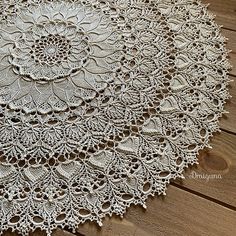 a white doily on a wooden floor