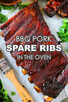 bbq pork spare ribs in the oven on parchment paper with parsley next to it