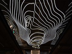 the ceiling is decorated with lines and shapes