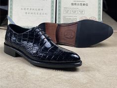 Having these shoes is the best thing to instantly add a glam quotient to your formal outfit. These men's Oxford shoes with a lace-up closure feature a crocodile skin design in the upper that adds uniqueness to your outlook. Made of crocodile skin and lined with cow skin leather, these shoes ensure comfortable walkability and durability.

Specifications




Upper Material: Crocodile Skin

Toe Shape: Pointed Toe

Shoes Type: Basic

Season: Spring/Autumn

Pattern Type: Solid

Outsole Material: Genu Lace-up Leather Shoes With Crocodile Pattern, Black Crocodile Pattern Oxfords For Business, Black Crocodile Pattern Wingtip Oxfords, Elegant Black Dress Shoes With Crocodile Pattern, Classic Black Oxfords With Crocodile Pattern, Formal Crocodile Pattern Cap Toe Dress Shoes, Formal Cap Toe Dress Shoes With Crocodile Pattern, Formal Lace-up Leather Shoes With Crocodile Pattern, Elegant Black Leather Shoes With Laces