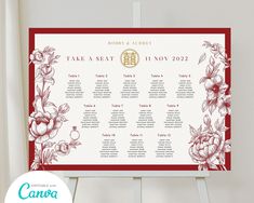 a red and white floral wedding seating chart