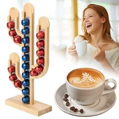 a woman holding a cup of coffee next to a wooden rack