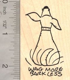 a wooden rubber stamp with an image of a woman's dress on it and the words wag more bake less