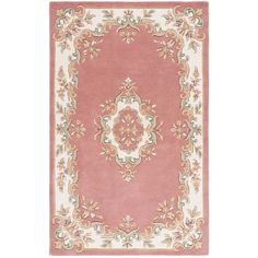 a pink rug with an ornate design on the front and back side, in various colors