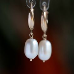 "Add a touch of elegance to any outfit with these beautiful 14k gold pearl earrings. White freshwater pearls are handpicked for their luster and beauty and dangle gracefully from 14k gold leverback closures. Luxurious and durable, these earrings are a great gift for any occasion, like a wedding, or for everyday wear.  MATERIALS * Freshwater Pearls * 14k Gold or 18k Gold * beautiful white branded gift box * card about white pearl SIZE: pearls: 10x7.5 mm;  earrings: 3 cm or 1 3/16\" MAKE A SET: Ma Elegant Hoop Clip-on Earrings For Formal Occasions, Elegant Hoop Clip-on Earrings For Formal Events, Elegant Formal Clip-on Hoop Earrings, Elegant Hoop Clip-on Earrings For Anniversary, Elegant Gold Huggie Clip-on Earrings, Elegant Huggie Clip-on Earrings, Classic Rose Gold Clip-on Earrings, Elegant Hoop Clip-on Earrings, Elegant Everyday Round Clip-on Earrings