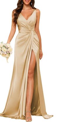 a woman in a long dress with a slit on the side and a flower bouquet