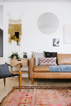 a living room filled with furniture and lots of color swatches to match the walls