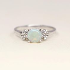 Natural Opal Engagement Ring Simple Opal with Side Diamond | Etsy Opal Birthstone Ring In White Gold, Classic Opal Rings With Birthstone, Classic Opal Ring With Round Stone For Anniversary, Classic Opal Ring For Anniversary With Round Stone, Classic Round Cut Opal Birthstone Ring, White 14k Gold Promise Ring, Silver Opal Birthstone Ring In 14k Gold, 14k Gold Stackable Rings With Center Stone, Silver Opal Ring In 14k Gold