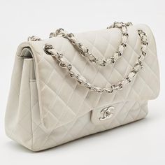 CHANEL Light Grey Quilted Leather Jumbo Classic Double Flap Bag   Reimagined season after season, the classic designs from Chanel manage to retain their classic glamour and noteworthy silhouettes. From one of the most celebrated collections, this authentic Jumbo Classic Single Flap bag is enriched with historic details and functional elements. Carry it with joy.    Size: Height: 20 cm, Width: 8.5 cm, Length: 30 cm   Material: Leather   This item has been used and may have some minor flaws. Befor Timeless Evening Bag With Double Flap, Timeless Double Flap Evening Bags, Vintage Double Flap Shoulder Bag For Formal Occasions, Birthday 15, Classic Glamour, Chanel Jumbo, Chanel Flap Bag, Versace Bags, Birkin 25