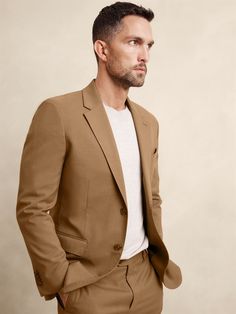 SUSTAINABILITY: Made with 59% recycled polyester. A timeless, elegant patterned suit designed for modern, everyday occasions. Crafted from a soft blended fabric, it combines comfort with style for a sophisticated look that withstands the test of time. Notch collar with button hole on wearers left panel. Four non-functioning buttons at cuffs. Two-button front closure. Front pockets. Chest pocket. Internal pockets. Single back vent. Matching suit trouser available. Made exclusively for Banana Republic Factory. #502112 Patterned Suit, Button Hole, Notch Collar, Banana Republic Factory, Suit Designs, Trouser Suits, Chest Pocket, Banana Republic, Camel