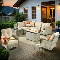 an outdoor living area with wicker furniture