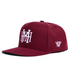 The MHH Heritage logo was designed by our founder, Mike Kurtz, in the early inception of the brand. Front of the hat features the MHH Heritage logo in puff embroidery. Left side of the hat features the original Mike's Hot Honey bee logo from 2010. Structured, six-panel, high-profile, burgundy, snapback hat. Embroidered locally in New York, NY. Honey Bee Logo, Puff Embroidery, Bee Logo, Heritage Logo, Hot Honey, Inception, Honey Bee, Snapback Hat, Snapback Hats