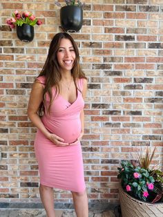 Welcome the springtime in style with this gorgeous pink maternity dress. Perfectly tailored to fit and flatter your growing baby bump, this elegant and feminine design will make you look and feel beautiful during your pregnancy. The soft pink hue is sure to bring a touch of freshness and romance to your wardrobe, while the stylish cut will show off your bump in all the right places. From date nights to family gatherings, this dress is the perfect choice for any special occasion. Maternity Sleeveless Nursing-friendly Dress, Nursing-friendly Sleeveless Maternity Dresses, Elegant Sleeveless Bump-friendly Maternity Dress, Elegant Sleeveless Bump Friendly Maternity Dress, Fitted Maternity Dress For Date Night, Fitted Sleeveless Maternity Dress, Elegant Sleeveless Bump-friendly Dresses, Elegant Sleeveless Bump Friendly Dresses, Fitted V-neck Dresses Bump Friendly