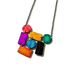 Save 20% on your order when you subscribe- https://www.mailchi.mp/b4b63543aa8d/sassysacha Add a bold pop of color to your day with this handcrafted necklace! From this listing you can purchase the necklace  or combine with matching earrings. Both the necklace and earrings were handmade from polymer clay and painted with vibrant alcohol inks. The set is lightweight and nickle free making it perfect for daily wear.  The necklace measures a unique mix of interconnecting rectangles and circles. It m Artsy Earrings, Colorful Statement Necklace, Plate Jewelry, Gel Plate, Polymer Clay Flower Jewelry, Multicolor Jewelry, Chunky Jewelry, Clay Necklace, Alcohol Inks