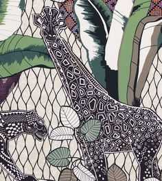 a giraffe and other animals are depicted in an artistic pattern on fabric,