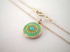 "Unique opal necklace. Tiny mint green & gold boho pendant necklace. Resin & sterling silver necklace. Every woman needs a gorgeous opal necklace that she'll treasure forever. This tiny, lightweight pendant necklace will keep your look feminine and elegant. A beautiful, classic addition to both your every day & evening wear. This necklace although small, will not go unnoticed, get ready to receive a lot of compliment on it! A great valentine's day, mothers day, or birthday gift for m Gold Bohemian Necklaces With Cabochon, Green Coin Pendant Jewelry As Gift, Green Coin Pendant Jewelry For Gift, Bohemian Gold Cabochon Necklaces, Gold Bohemian Cabochon Necklace, Bohemian Gold Cabochon Necklace, Green Necklace With Coin Pendant, Bohemian Green Jewelry With Delicate Chain, Handmade Opal Round Pendant Necklace