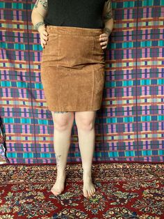 This gorgeous chocolate brown leather mini skirt is in amazing vintage condition and has no flaws at all. The back half of the waist is elastic, so its comfortable and fits a good variety of body types! This vintage size 16 is closer to a modern size 12, and we have it modeled here on a women's size large model who is about 5'6".size 16. 100 leather, lined29" waist40" hips21" long Brown Fitted Mini Skirt For Fall, Fitted Brown Mini Skirt For Fall, Brown Pencil Skirt With Pockets, Fitted Brown Pencil Mini Skirt, Brown Fitted Pencil Mini Skirt, Brown Fitted Short Skirt, Fall Mini Length Brown Skirt, Vintage Mini Bottoms For Fall, Vintage Mini Length Bottoms For Fall