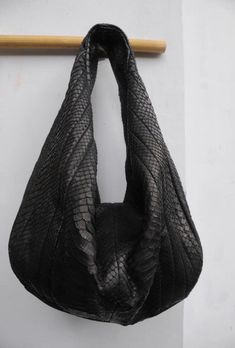 Big Soft Hobo Genuine Python Skin Bag Face: genuine pyhton skin Lining: eco suede Color: black Decorated with stitches Inside: one big compartment and small side zippered pocket Bag measuremets: width 43 см, height 30 см, depth 12 cm (16.92/11.81/4.72 inches) Handmade in Bali with lots of love This is a made to order item, usually it takes from 1-2 weeks to ship it depending on tailors capacity and bali local holdays If you need any adjustments please feel free to message me Please note that pyt Luxury Hobo Tote Bag With Top Carry Handle, Luxury Hobo Bag Tote With Top Carry Handle, Cheap Pouch-shaped Hobo Bag For Shopping, Luxury Hobo Bag With Top Carry Handle For Shopping, Luxury Hobo Bag Satchel With Branded Hardware, Luxury Hobo Bag With Zipper Closure For Shopping, Luxury Top Handle Hobo Bag With Multiple Compartments, Luxury Shoulder Hobo Bag With Multiple Compartments, Luxury Handmade Hobo Bag For Daily Use