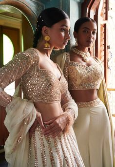 A stunning off-white lehenga with a gold embroidered blouse and skirt bottom.From Bindani’s Rang Mahal collection DELIVERY TIMEPlease allow 8-12 weeks for your outfit to arrive. FABRIC DETAILSHabutai silk Professional cleaning only. Elegant Off-white Lehenga For Festive Occasions, Festive Cream Sets For Transitional Season, Designer Cream Sets With Traditional Drape, Cream Lehenga With Traditional Drape For Parties, Semi-stitched Cream Lehenga For Party, Elegant Cream Choli For Designer Wear, Off White Sets With Intricate Embroidery For Transitional Season, Off White Embroidered Sets For Transitional Season, Bollywood Style Party Palazzo Set With Intricate Embroidery