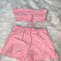 Nwot Two Piece Set. Light Pink Color. Top Is Bandeau Style With Tight Bottom And Tied For Adjustment. Size Small. Imo I Would Say It’s A True Small. Just Wrinkled From Being In The Plastic Bag For So Long. Never Even Used. Fitted Pink Short Top, Fitted Summer Crop Top With Drawstring, Pink Short Crop Top For Summer, Fitted Pink Top With Drawstring, Fitted Pink Tops With Drawstring, Trendy Cotton Crop Top With Drawstring, Summer Stretch Top With Drawstring, Short Spring Tops With Drawstring, Summer Fitted Crop Top For Loungewear