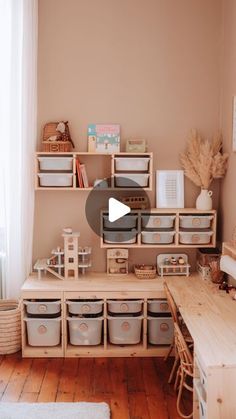 a living room filled with lots of furniture and storage containers on top of a wooden table