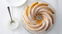 a cake with icing and orange slices on a plate