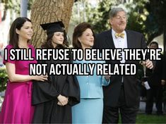 a group of people standing next to each other in front of a tree with the caption still refuse to believe they're not actually related