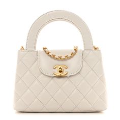 This is an authentic CHANEL Shiny Aged Calfskin Quilted Nano Kelly Shopper in White. This chic mini bag is crafted of quilted calfskin leather in white. The bag features rolled top handles, a gold chain leather threaded shoulder strap, and a crossover strap with a gold CC turn lock. This opens to a white leather interior with zipper and patch pockets. White Chanel Bag, Chanel Mini Bag, Tas Chanel, Chanel Crossbody, White Shoulder Bag, Tas Fashion, Chanel Mini, Kelly Bag, White Purses