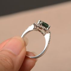 This is a gorgeous handmade creation. Its beauty is its simplicity & Elegance. The 7*7mm cushion cut lab green sapphire is crafted in solid sterling silver and with rhodium plated. All item is sent in a beautiful gift box You can realize more lovely stuff clicking the link https://www.etsy.com/shop/knightjewelry?refshopsection_shophome_leftnav Please leave the correct address and you phone number for delivering successfully. Green Sapphire Rings With Halo Setting, Green Sapphire Ring With Halo Setting For Promise, Silver Emerald Ring With Halo Detail, Green Sapphire Jewelry With Halo Setting, Elegant Green Sapphire Ring With Halo Setting, Silver Emerald Ring With Asscher Cut Cubic Zirconia, Green Moissanite Jewelry In Radiant Cut, Green Moissanite Jewelry With Radiant Cut, Green Moissanite Radiant Cut Jewelry