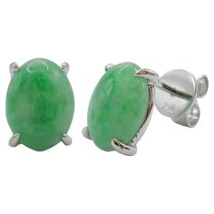 Introducing our stunning 8x6mm Burmese Oval Cabochon Apple Green Jadeite Jade Ear Studs in 18K White Gold, a pair of exquisite earrings that exude elegance and showcase the natural beauty of jadeite jade. These ear studs feature two captivating Burmese oval cabochon apple green jadeite jades, each measuring 8x6mm and totaling 2.52 carats, set in lustrous 18K white gold. At the heart of each ear stud lies a remarkable Burmese oval cabochon apple green jadeite jade. Known for its exceptional quality and prized for its vibrant green color, this jadeite jade exhibits a captivating hue reminiscent of a crisp and juicy apple. The cabochon cut enhances the stone's smooth surface, creating a polished and alluring appearance. Crafted in 18K white gold, the metal setting beautifully enhances the all Luxury Green Oval Gemstones, Elegant Green Gemstone Cabochons, Elegant Oval Green Gemstones, Elegant Green Oval Gemstones, Elegant Green Cabochons As Gifts, Elegant Green Cabochons For Gifts, Oval Green Gemstones For Formal Occasions, Classic Oval Gemstone Cabochons, Classic Oval White Gold Cabochons