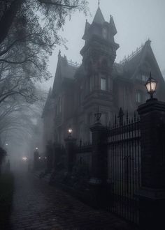 an old house is shown on a foggy night with street lights and trees in the foreground