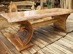 a wooden bench sitting on top of a wooden floor