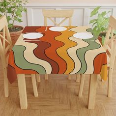 a dining room table covered with an abstract design