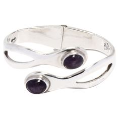 This stunning vintage Mexican sterling silver bangle bracelet will make a stunning addition to any jewelry collection! Crafted from sterling silver, this gorgeous bangle bracelet features 6.9ctw of amethysts. The bracelet is hinged for easy on and off, and measures 6.25 inches in length. Perfect for adding a luxurious touch to any ensemble, this Mexican silver jewelry makes an excellent gift for any occasion. Let this Vintage Mexican 6.9ctw Amethyst Bangle Bracelet in Sterling Silver be the stan Formal Sterling Silver Amethyst Bracelet, Sterling Silver Amethyst Bracelet For Formal Occasions, Elegant Sterling Silver Amethyst Bracelet, Elegant Sterling Silver Amethyst Gemstone Bracelet, Elegant Amethyst Jewelry With Sterling Silver Clasp, Formal Amethyst Gemstone Sterling Silver Bracelet, Sterling Silver Oyster Bracelet For Anniversary, Elegant Sterling Silver Amethyst Bracelet For Formal Occasions, Adjustable Gemstone Bangle For Formal Occasions