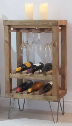 a wine rack with several bottles and glasses