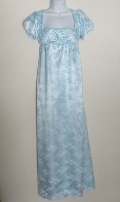 Blue Regency Style Floor-length Dress, Blue Regency Style Evening Dress, Regency Style Floor-length Evening Gown, Regency Style Fitted Gown With Lace Trim, Regency Style Empire Waist Evening Gown, Elegant Victorian Empire Waist Dress For Daywear, Regency Style Dress With Empire Waist And Lace Trim, Regency Style Dress With Lace Trim And Empire Waist, Regency Style Empire Waist Wedding Maxi Dress