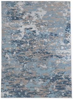 an abstract rug with blue, beige and white colors on it's surface is featured in this image