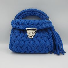 Luxury Crochet Bag - Capri Knit Royal Blue Shoulder Bag - Handmade Boho Designer Tote, Elegant Artisanal Crossbody Bag Introducing our luxurious Capri Knit Royal Blue Crochet Bag, a perfect blend of elegance and practicality. This handmade boho shoulder bag is meticulously crafted to bring a unique touch of sophistication to your style. Its vibrant royal blue color and intricate knit pattern make it an eye-catching accessory for any occasion, whether it's a casual outing or a special event. Feat Blue Top Handle Shoulder Bag With Braided Handles, Blue Top Handle Bags With Braided Handles, Blue Bags With Braided Top Handles, Blue Crochet Bag With Top Handle For Everyday Use, Blue Knitted Shoulder Bag For Daily Use, Blue Handwoven Top Handle Bag, Blue Knitted Shoulder Bag For Everyday, Blue Woven Crossbody Shoulder Bag, Blue Woven Top Handle Bag