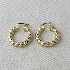 If you have to choose one unique hoop earrings that is sophisticate and very exclusive this is the one. Made with a two tubes of 5mm where is hand twisted one by one to have a piece of fine jewel. The Croissant Hoops. You will love it and you must have one in your collection Available in three different sizes 18mm, 20mm, 25mm and 30mm diameter. Latch closure Hypoallergenic Waterproof Handcrafted in Brazil Would you like to become a GoldFi Ambassador? Apply here. Unique Hoop Earrings, Tube Hoop Earrings, Amy Brown, Dry Well, Choose One, Fine Jewels, Wholesale Jewelry, Cleaning Clothes, Cross Pendant