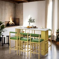 a dining room table with green chairs and a fire place in the fireplace behind it